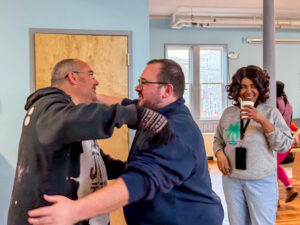 EPH Executive Director Matthew Caughey greets Thanksgiving food distribution volunteers.
